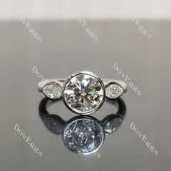 Angelina-Round bezel three stones moissanite engagement ring| DovEggs