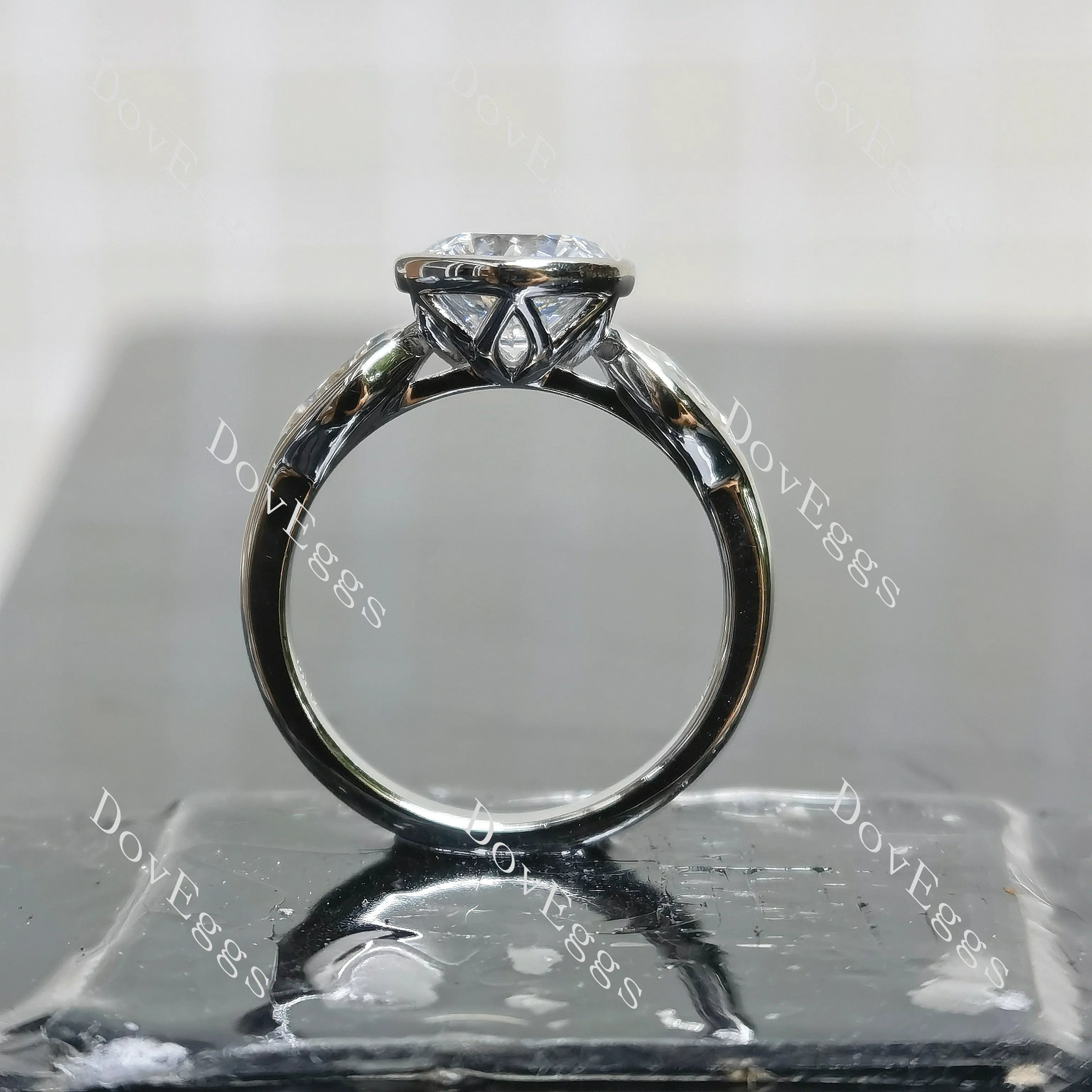Angelina-Round bezel three stones moissanite engagement ring| DovEggs