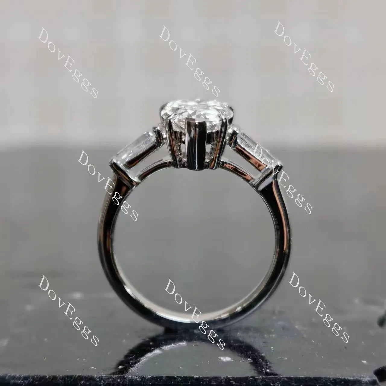 The Maddox-Pear three stones moissanite engagement ring| DovEggs